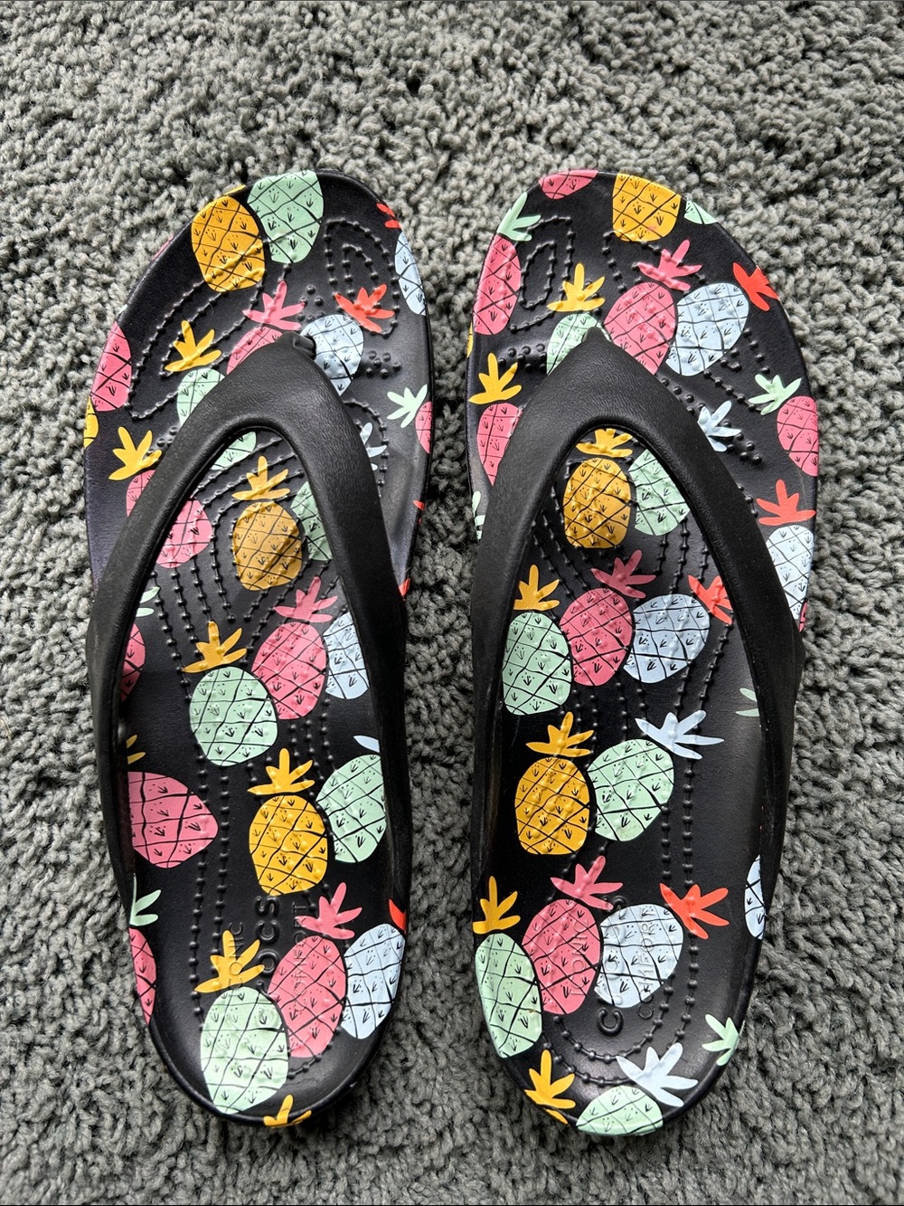CROCS Black Flip Sandals with Multicolor Pineapple Print